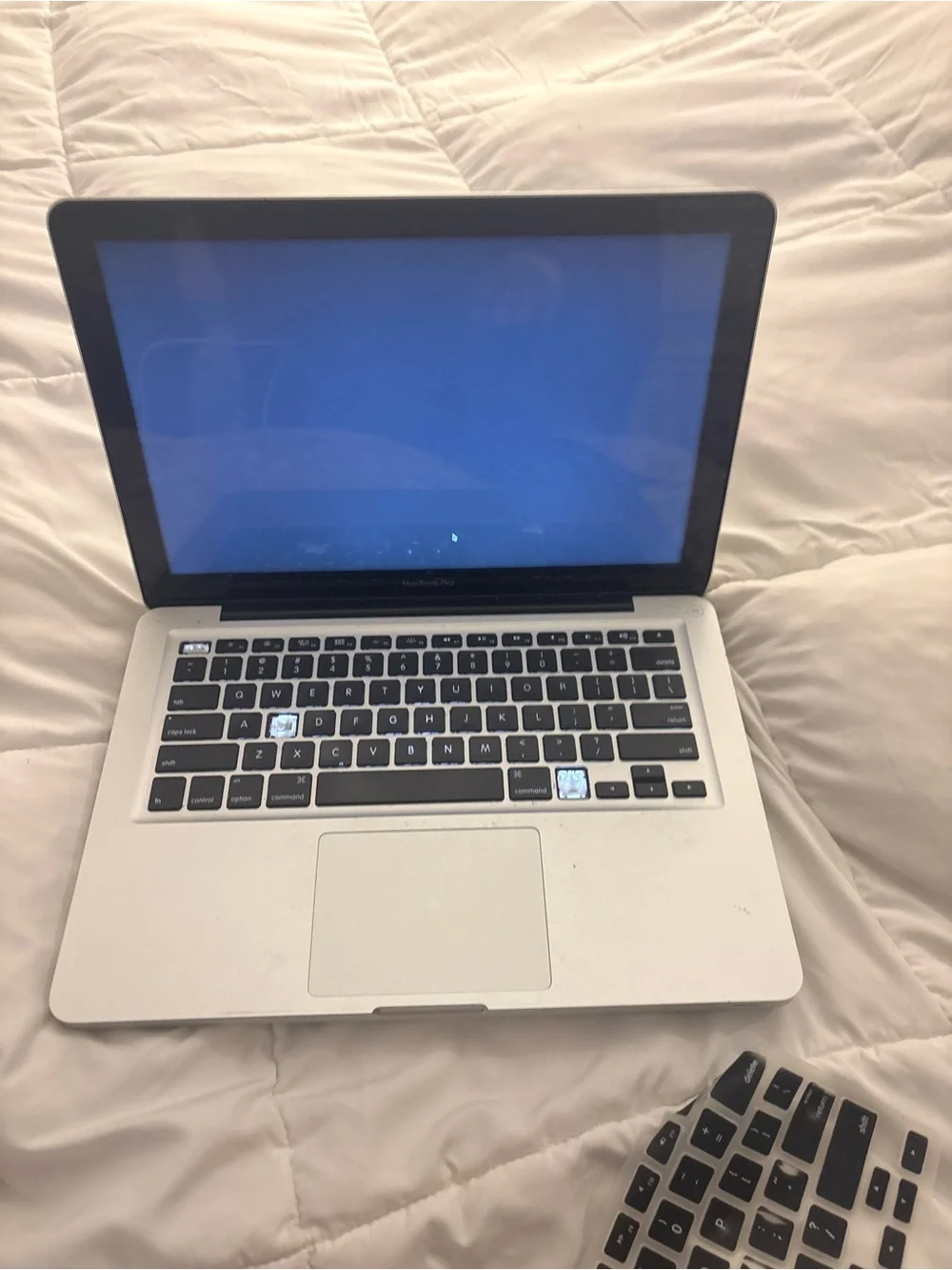Apple Silver MacBook Pro with Charger and Keyboard Cover